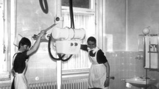 Ravensberg sister (left) and deaconess (right) in Gilead's X-ray department, 1960s