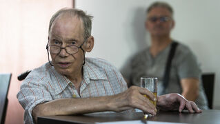 Anton Bals with a glass of apple juice in his hand at an event organised by the Politischer Stammtisch. 