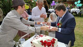 The couple cut the wedding cake together.