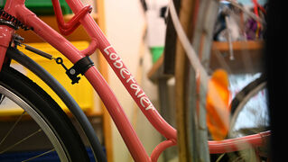 Pink bicycle frame with logo