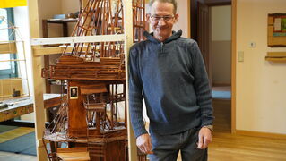 Martin Pflock stands in front of his work of art.