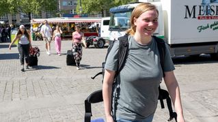 Lelaina Otto walks across the market