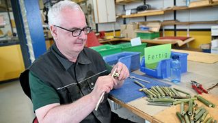 Christian Meyer files the bamboo tubes.