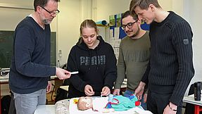 Pupil practising on a training dummy.