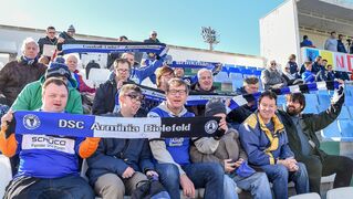 The Bethel fan club cheers on the footballers.